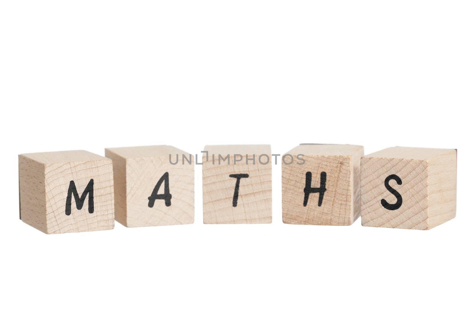 Maths written with wooden blocks. White background.