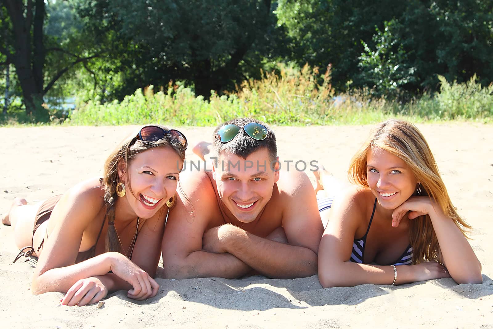 Young men have a rest and play a beach