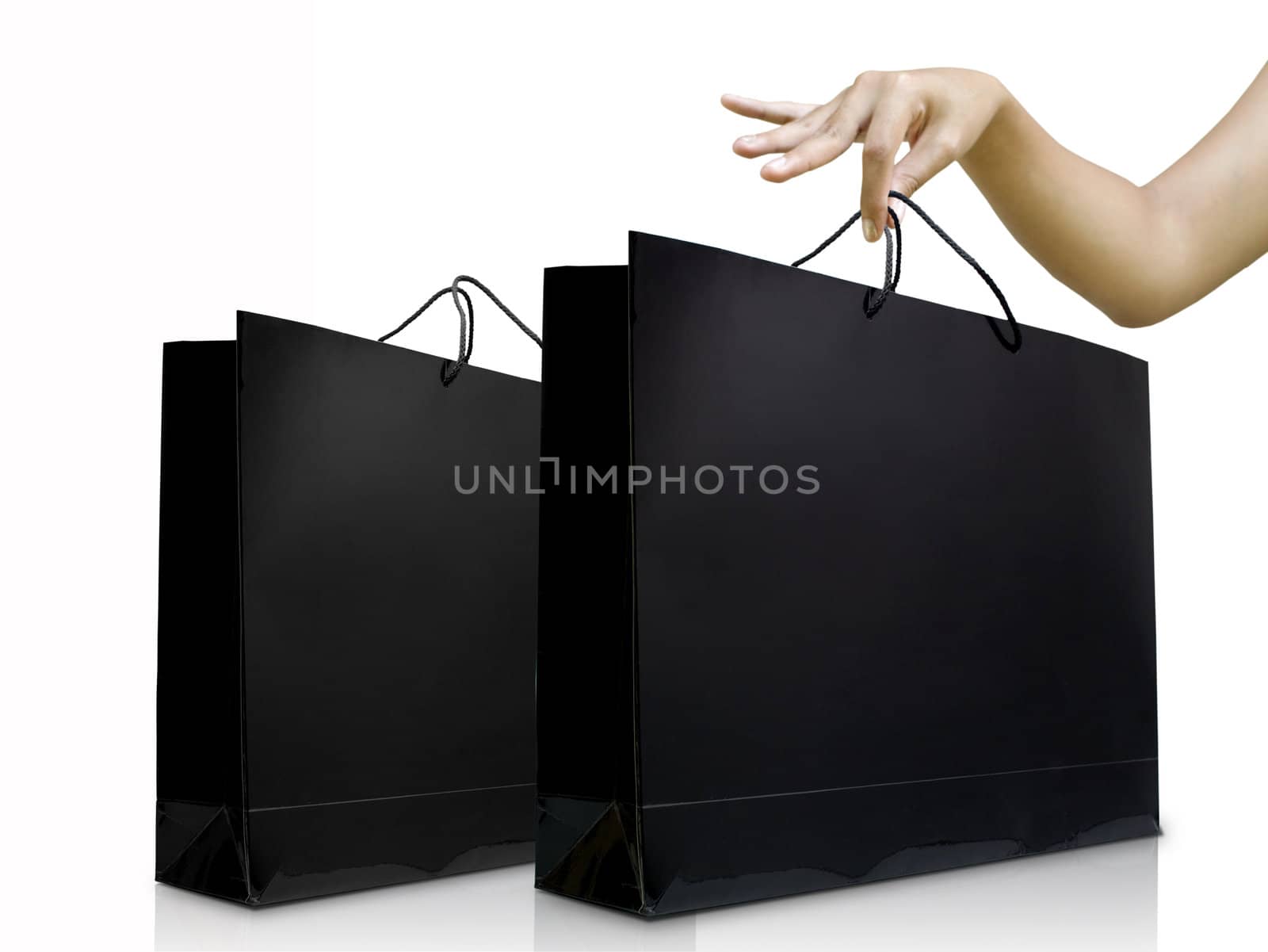 Lady hand pick the black shiny shopping bag, Shopping concept