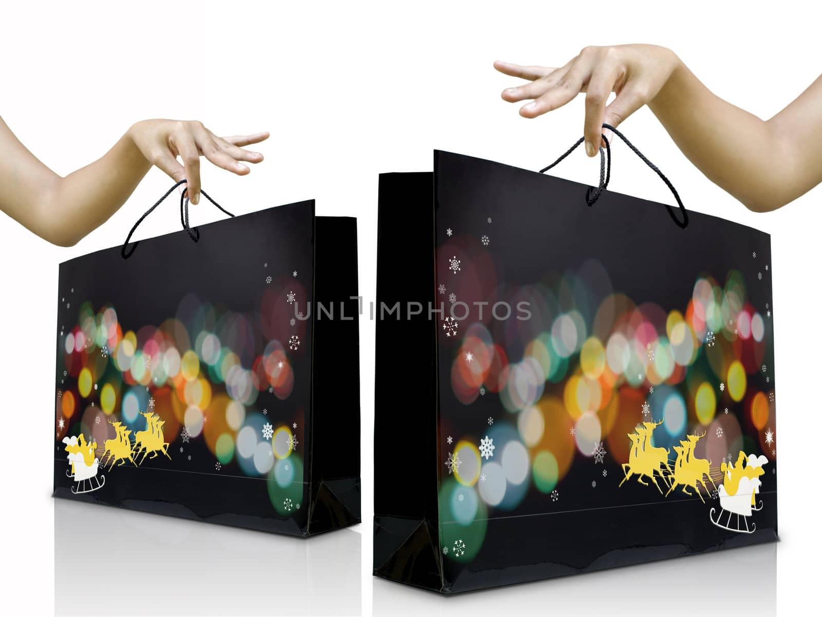 Women hands pick up the christmas shopping bag by pixbox77