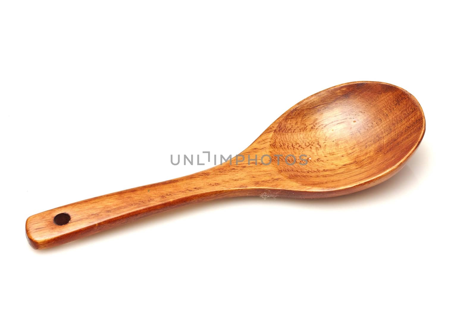 Wooden spoon isolated on white background