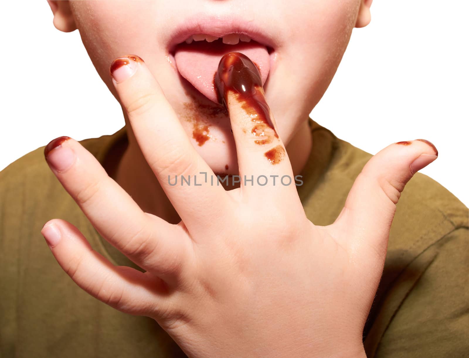 Child licks a chocolate glaze with your finger by subos
