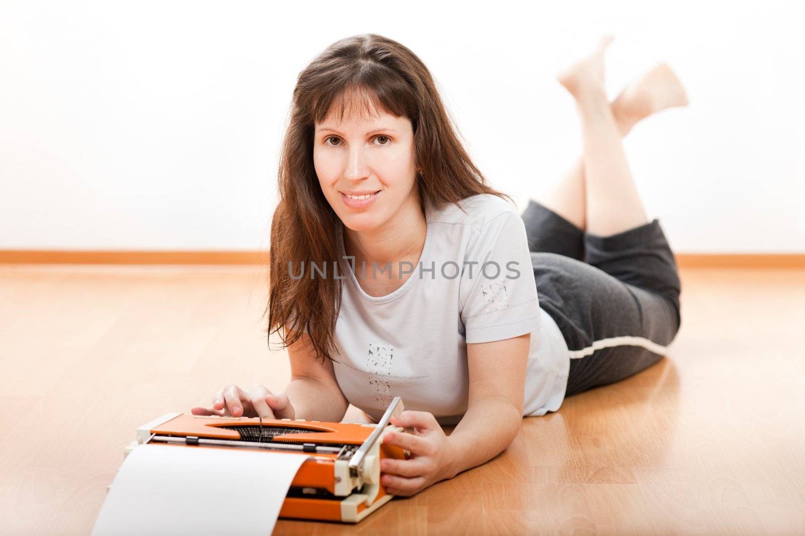 Women typing typewriter by ia_64