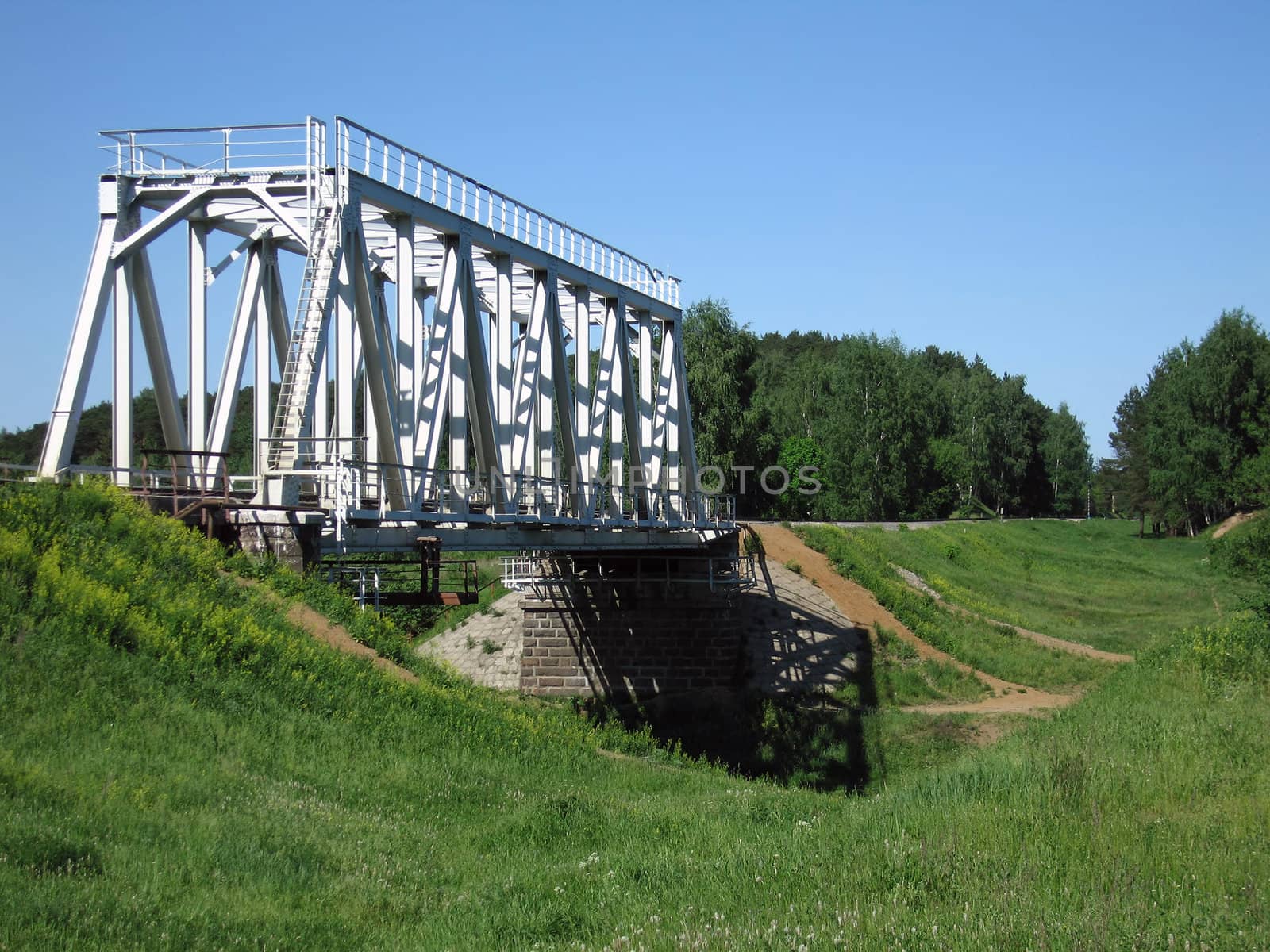 Train truck and railroad bridge on river