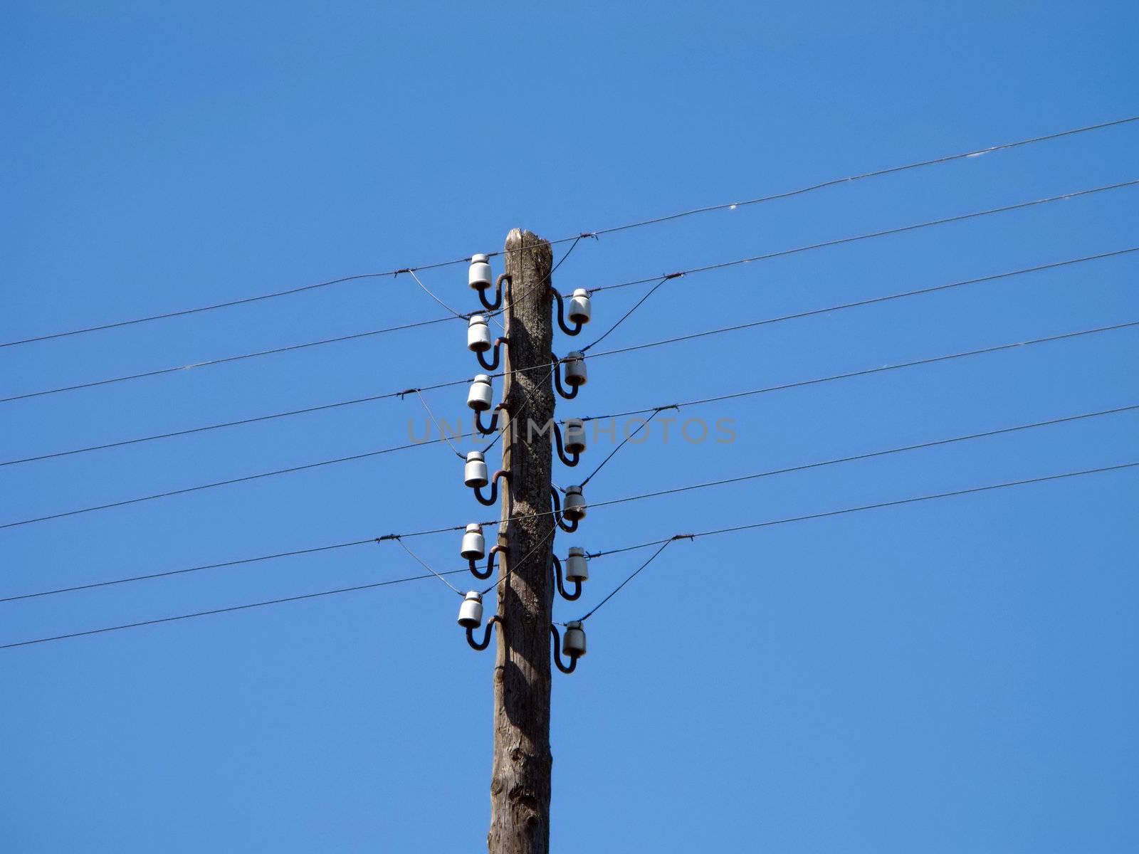 Electricity tower and power line cable on blue sky