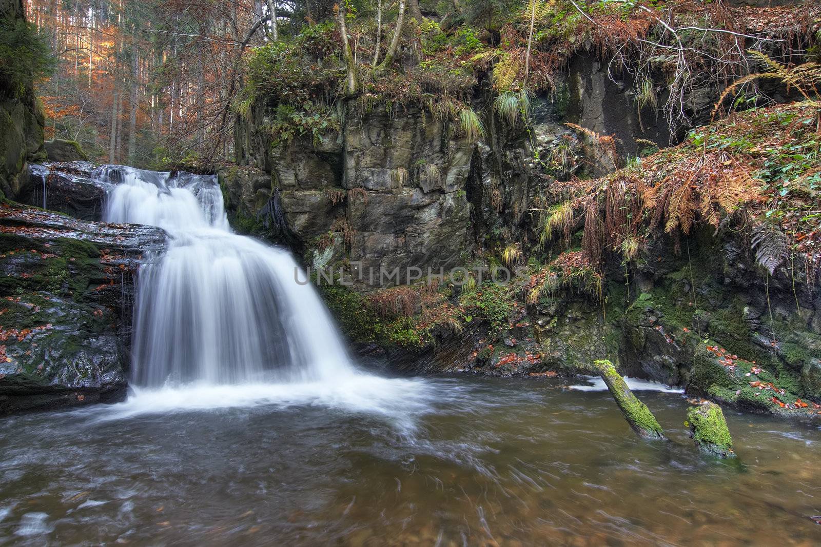 Shot of the fall of water. Stream Huntava - natural area - nature preserve.
Resov, Czech republic, Europe.