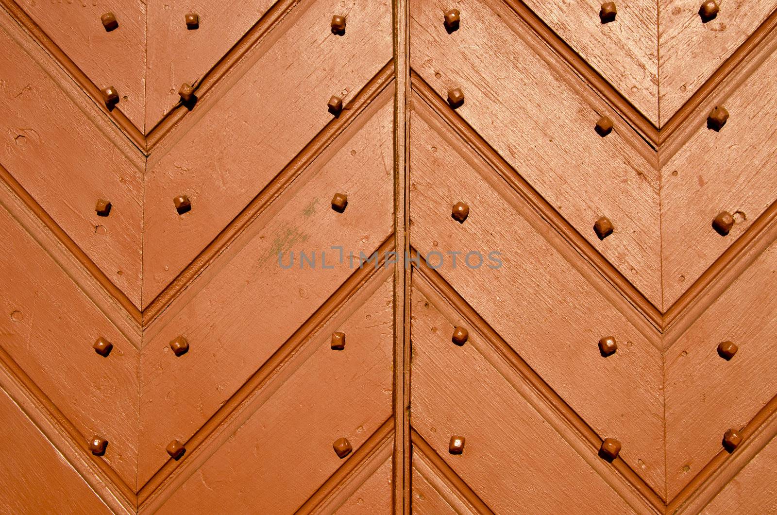 Antique wooden doors closeup and details. Architectural textures and background.