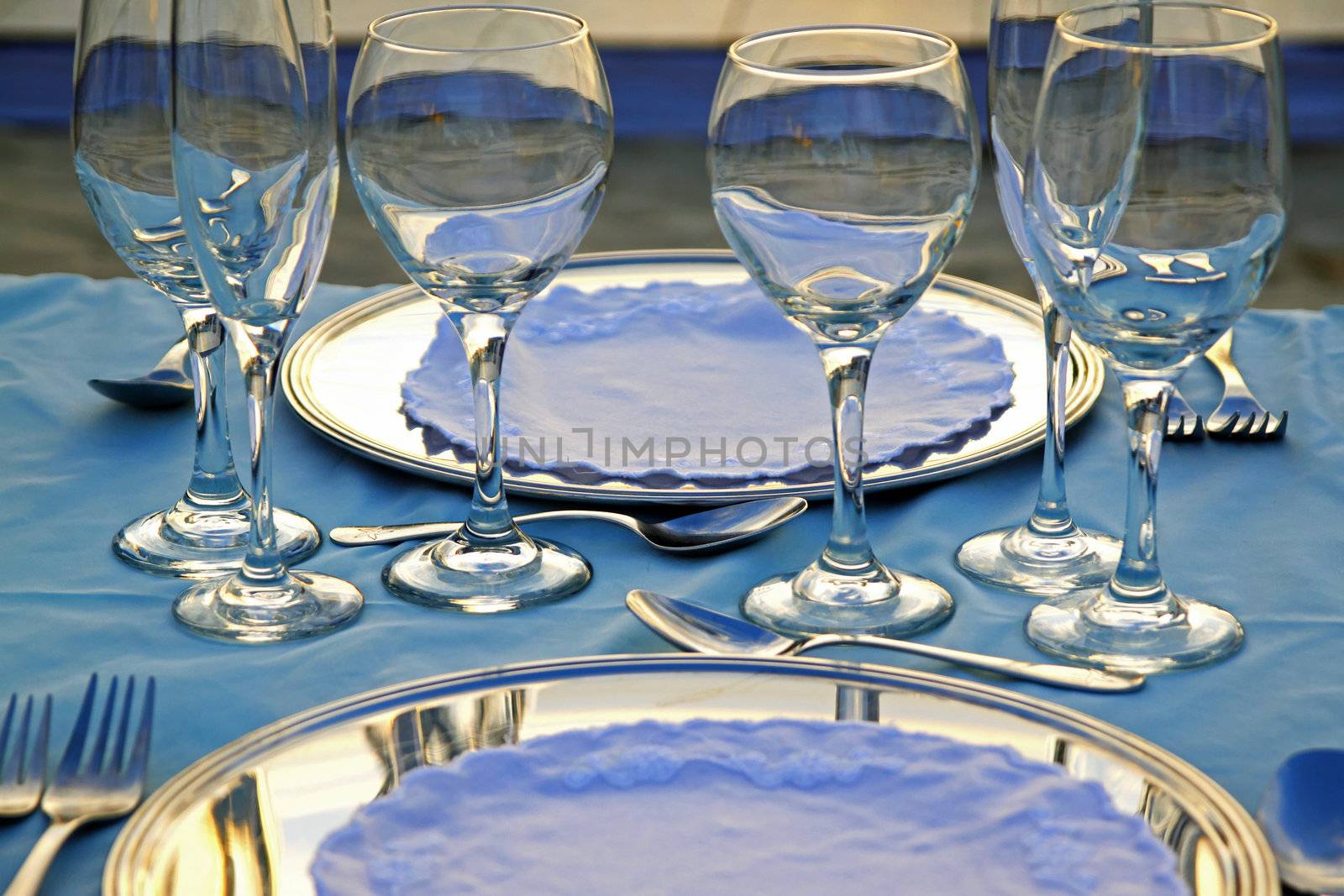 Exterior place setting for ocean side wedding celebration