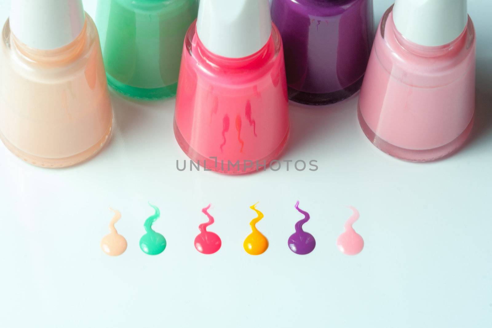 Bottles with spilled nail polish by sfinks