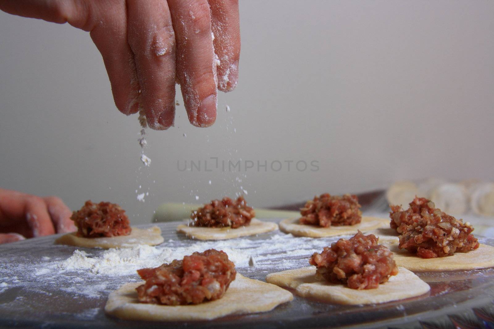 hand made ravioli getting prepared on table 