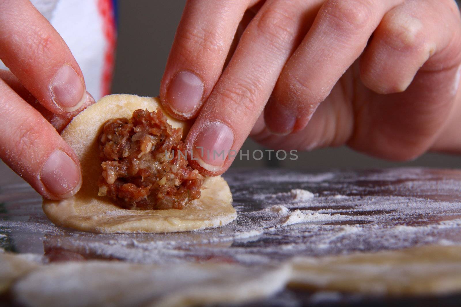 hand made ravioli getting prepared on table 