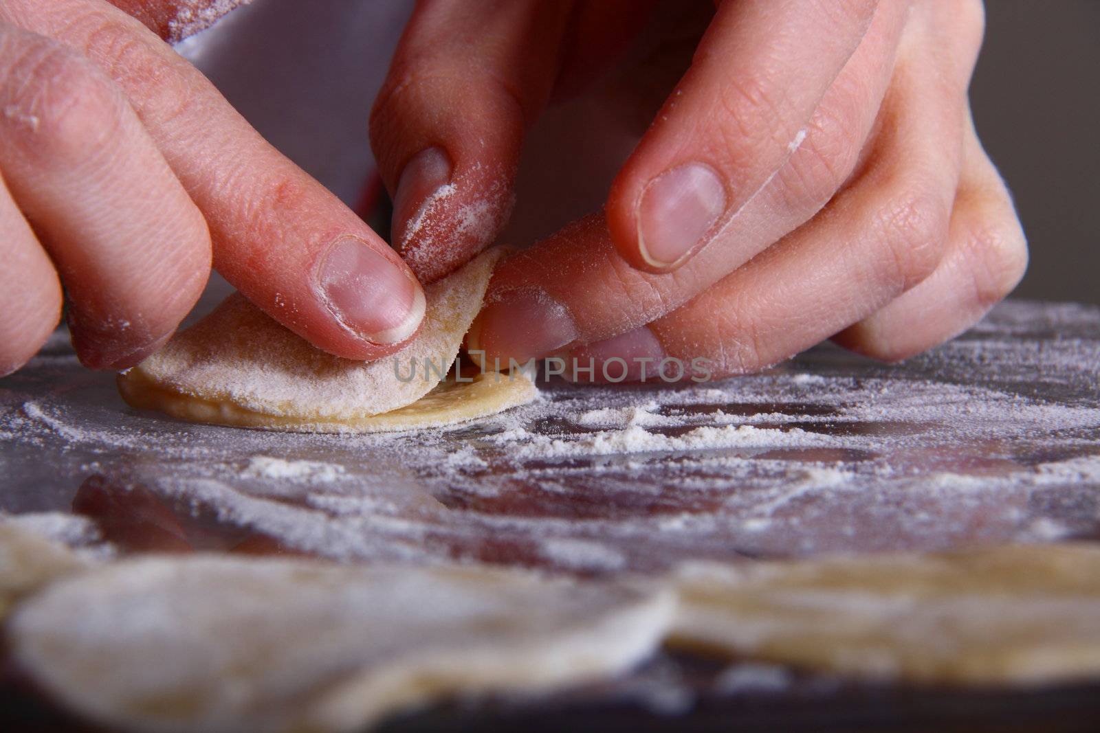 hand made ravioli getting prepared on table 