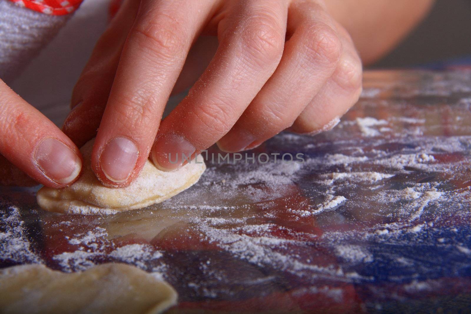 hand made ravioli getting prepared on table 