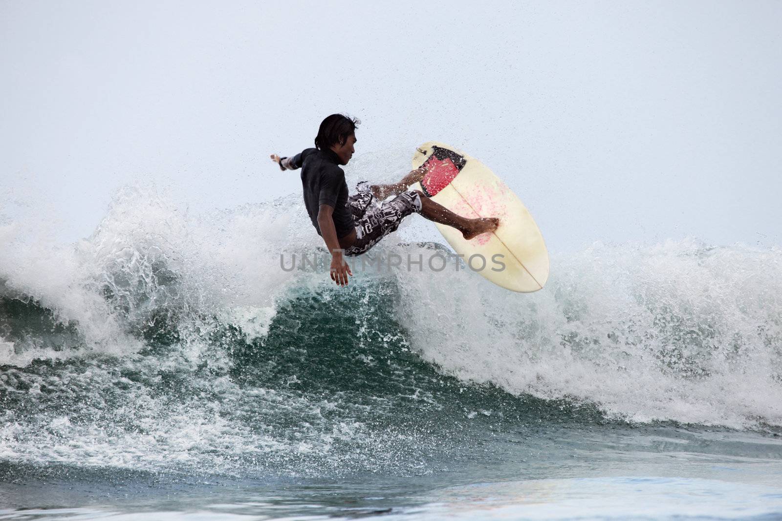 Surfer in ocean by friday