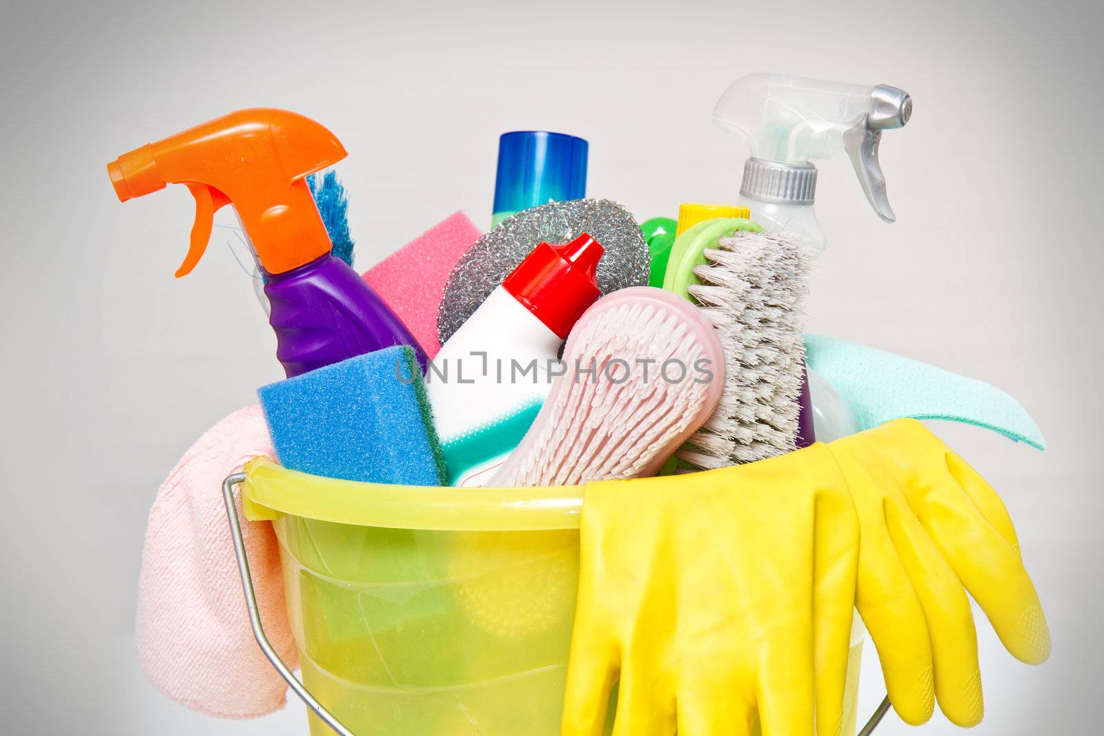 full box of cleaning supplies and gloves isolated on white by lsantilli