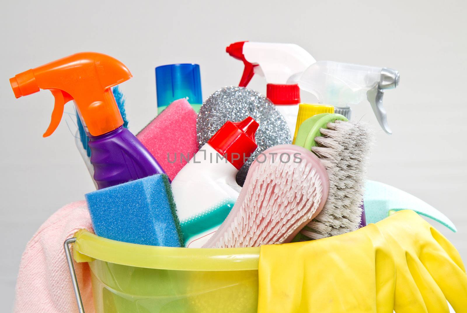 full box of cleaning supplies and gloves isolated on white