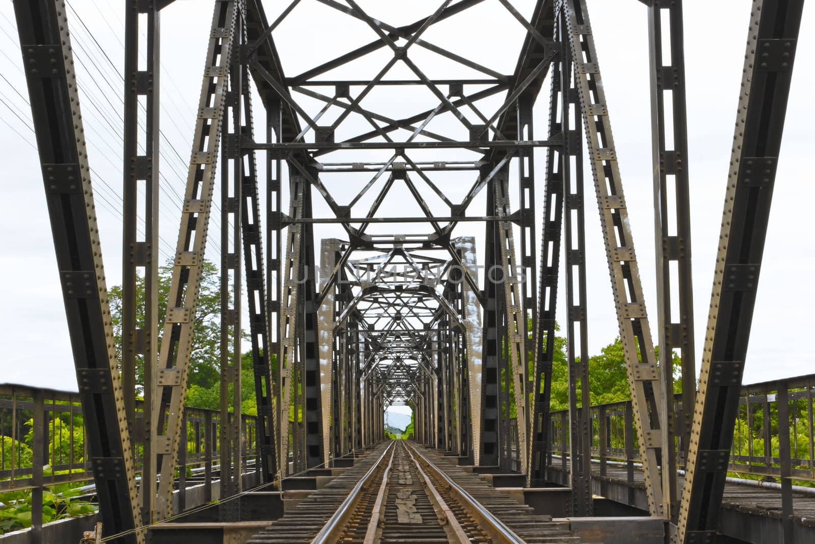 Old railway  black bridge in lampang, Thailand by sutipp11