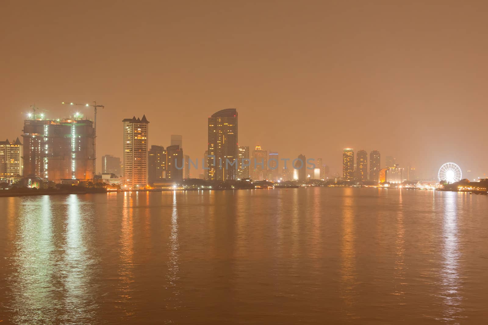 Chao Phraya river and city at night of Bangkok, Thailand