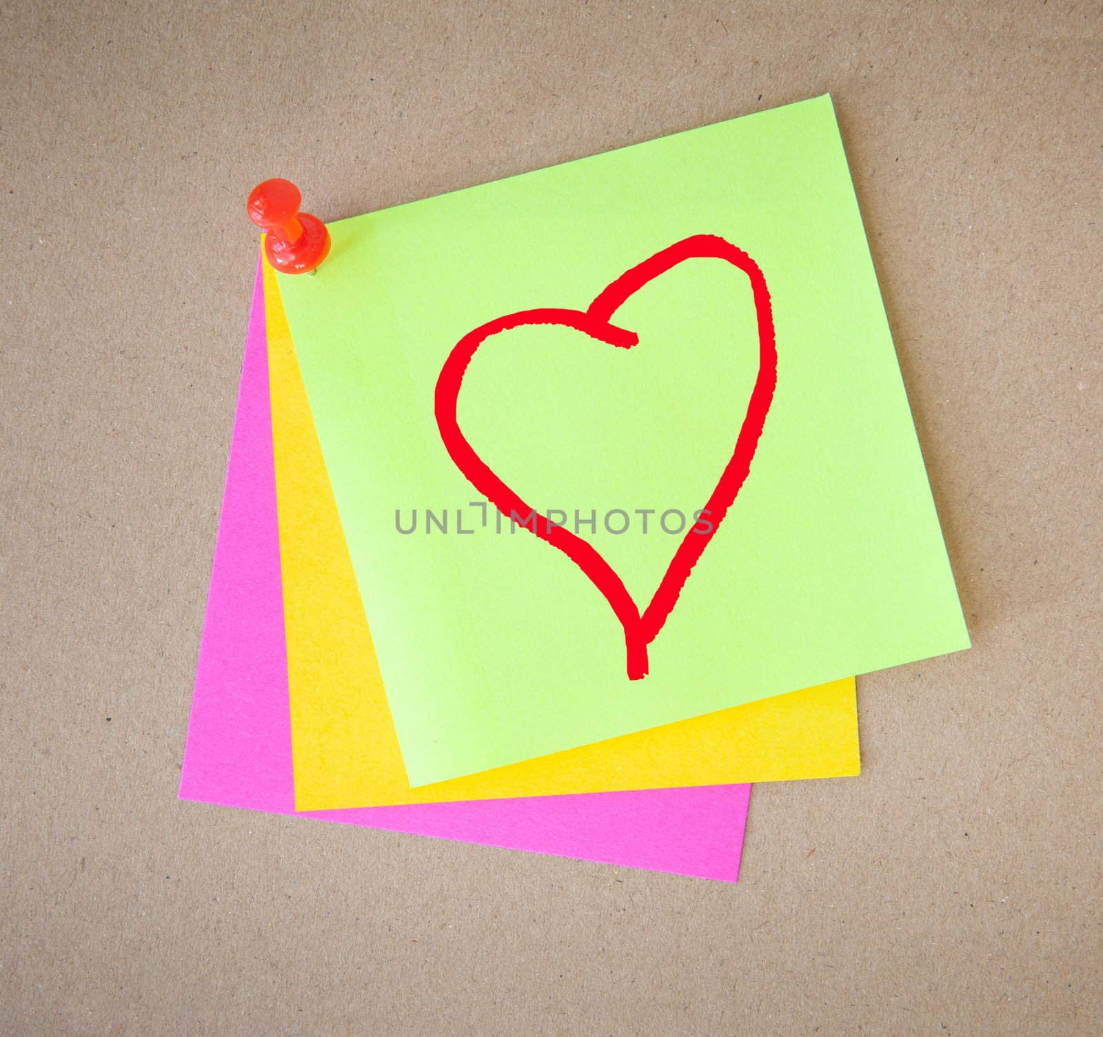 color paper and pin on wood texture background