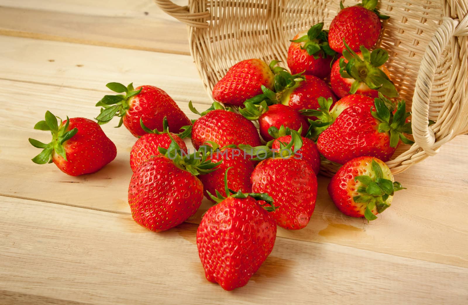 Red strawberries on old wood table