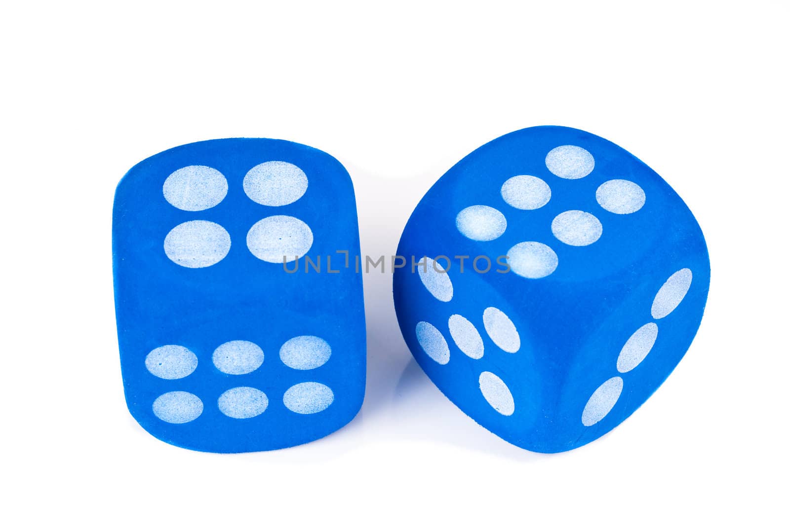 Two big blue fuzzy dice on white background.