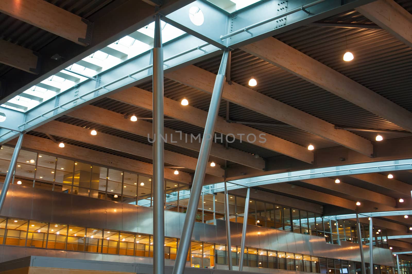 Inside a modern international airport terminal made of steel, glass and wood