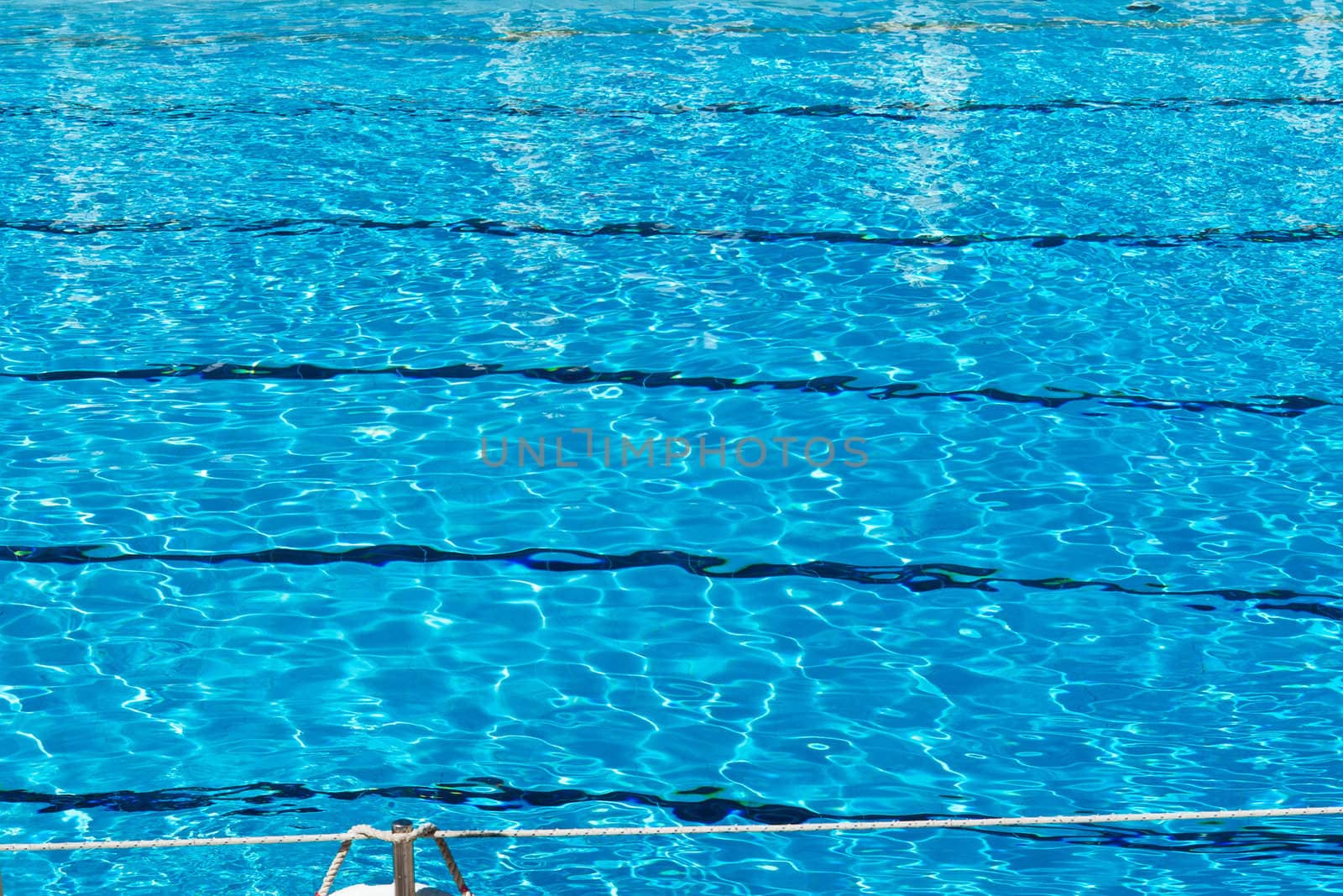 rippled pattern of water in a swimming pool by Ronyzmbow