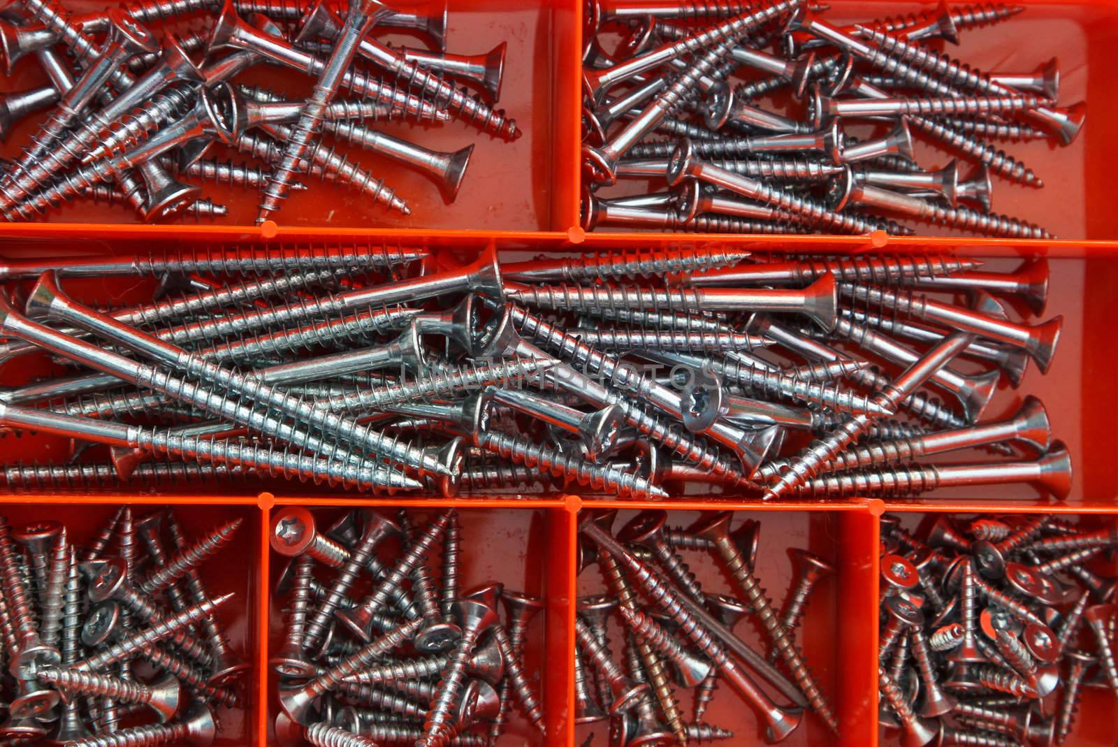 Several nails in a red box