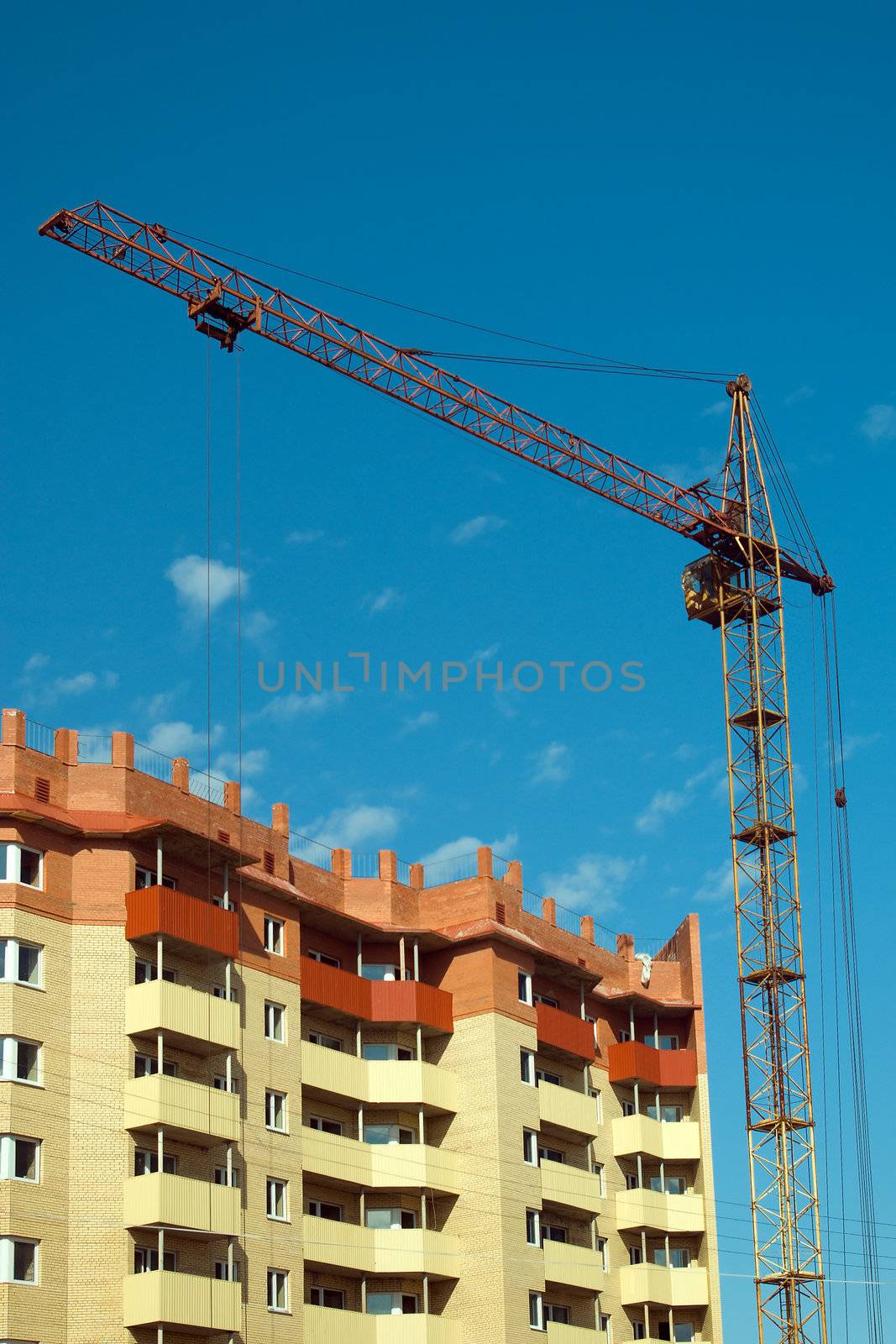 Lifting crane on building of the new house.The Building technology.