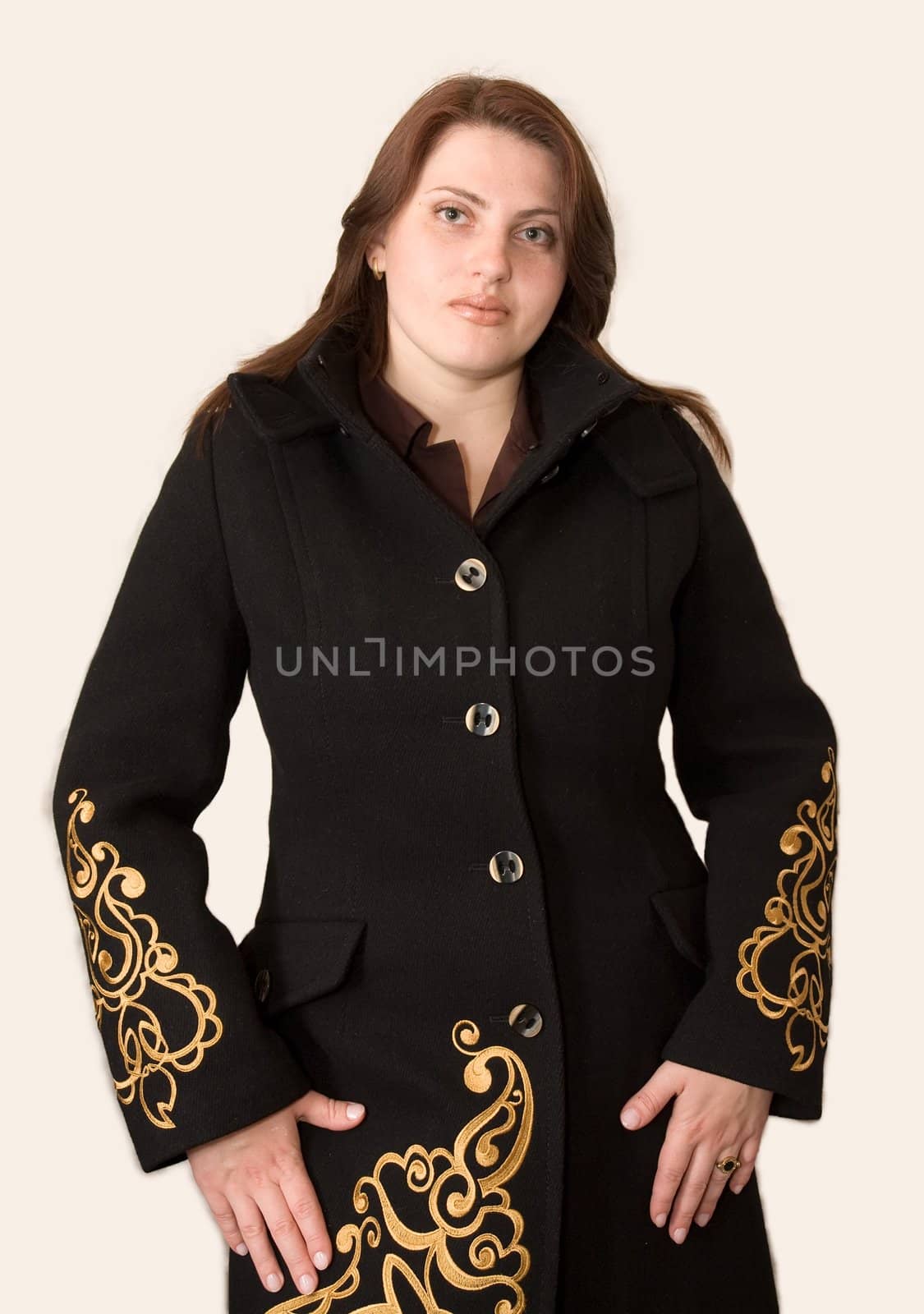The young beautiful woman in a black coat