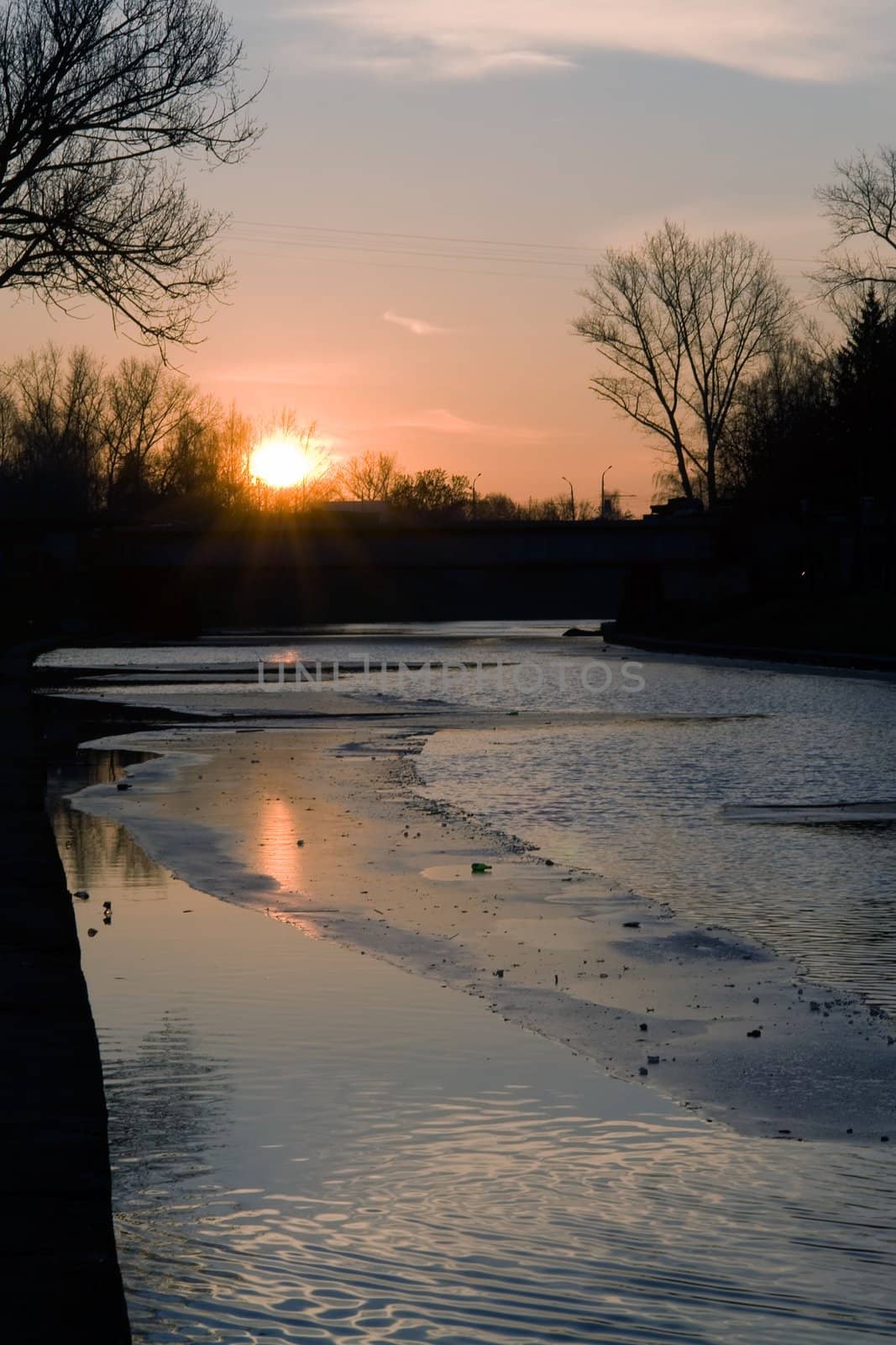 Early spring. Sunset. Ice on the river.