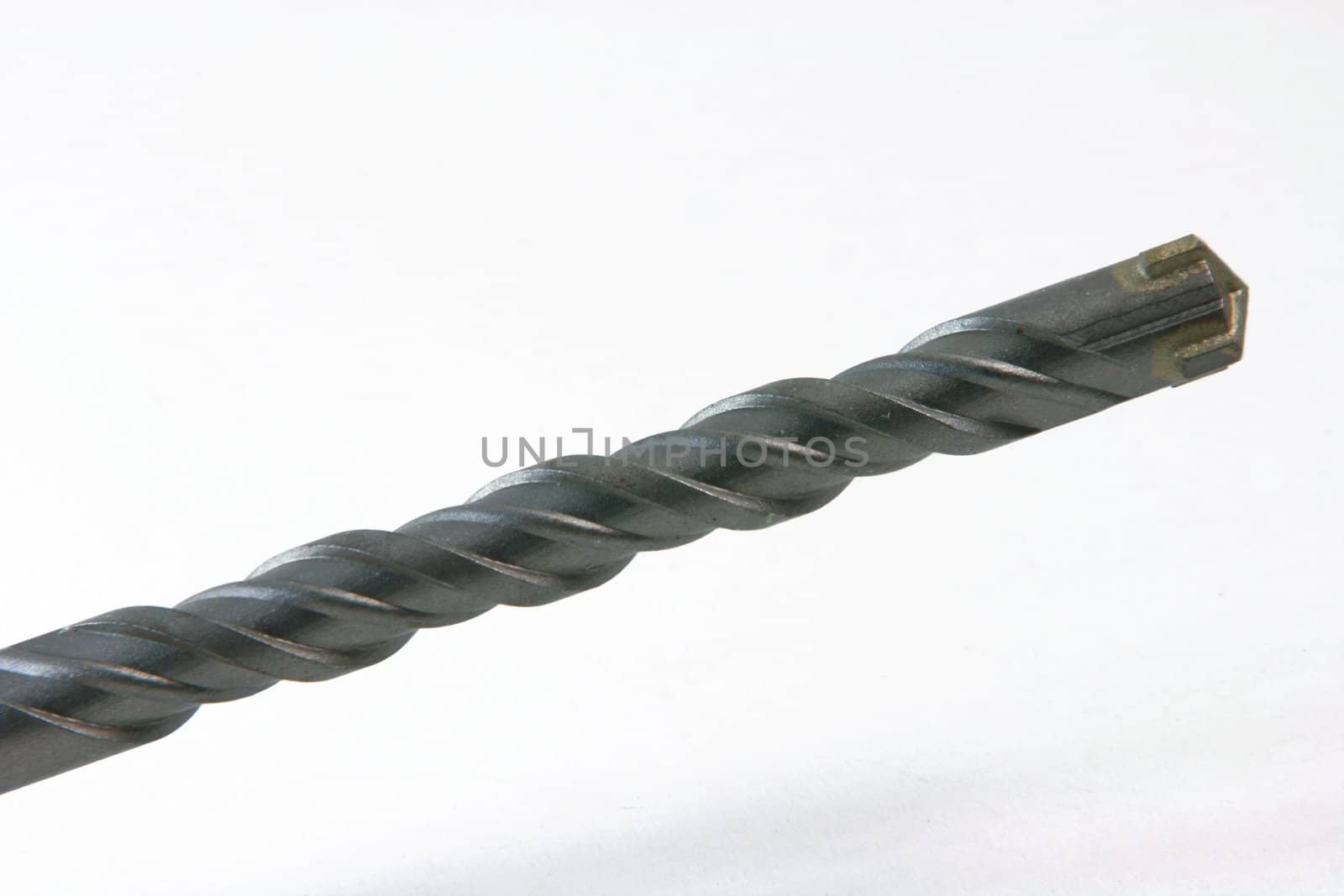 closeup detail from metalic drill on white background construction concepts