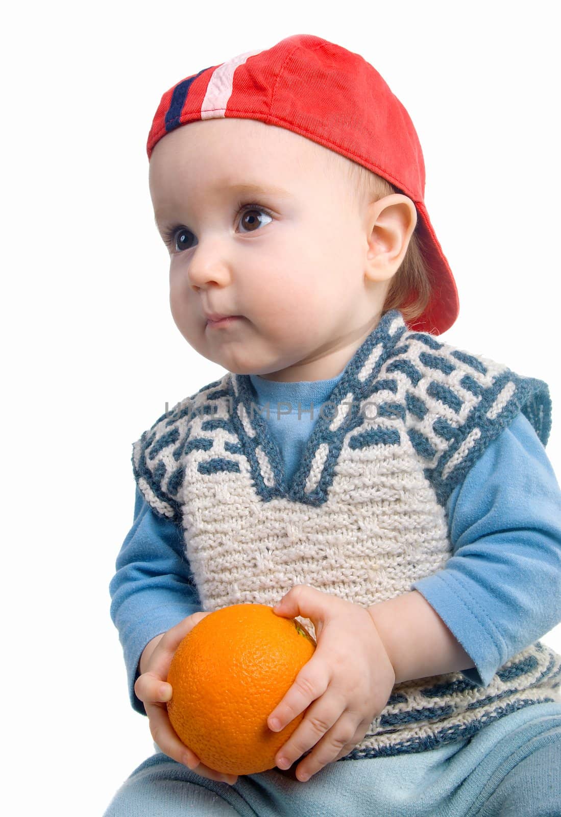 Study of the orange by small boy, useful and tasty fruit