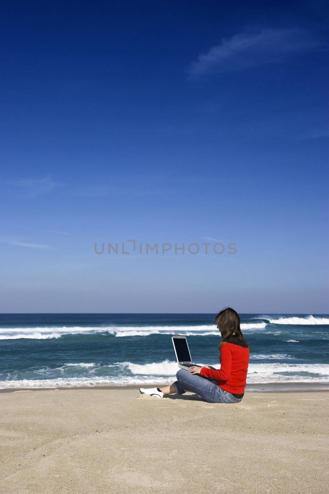 Woman with a laptop by Iko