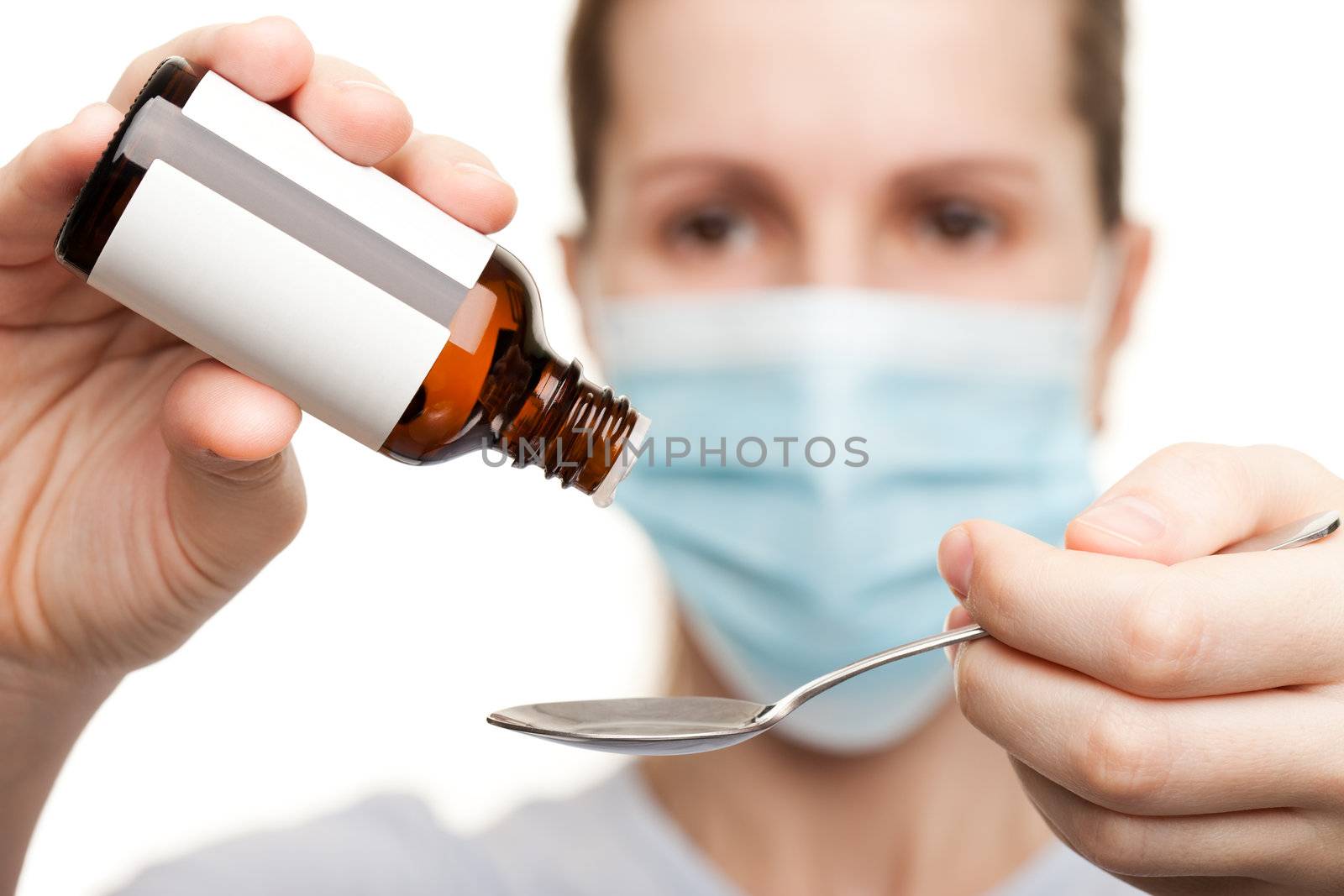 Doctor in mask holding medicine syrup by ia_64