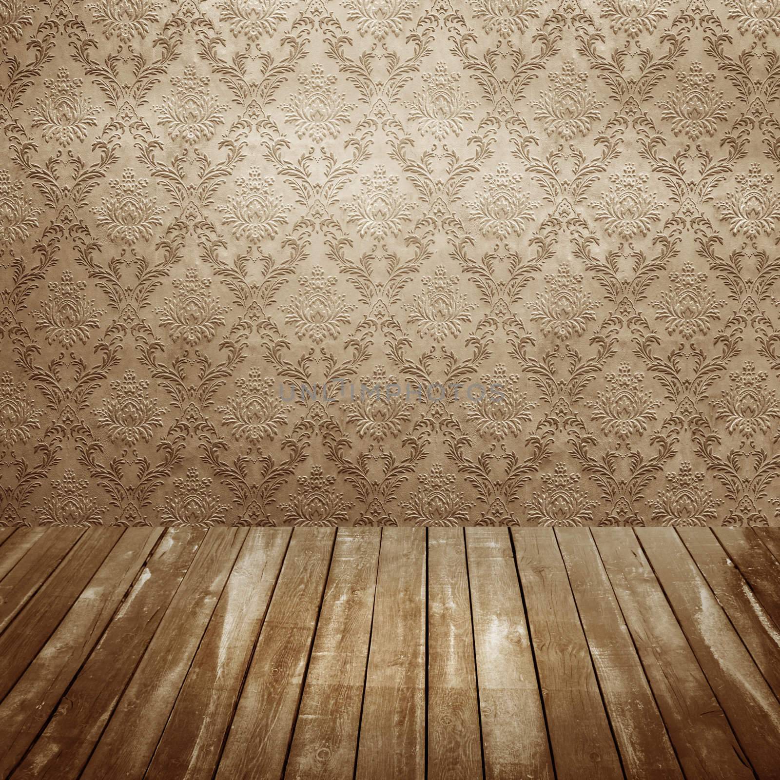 room with wooden floors and old wallpaper
