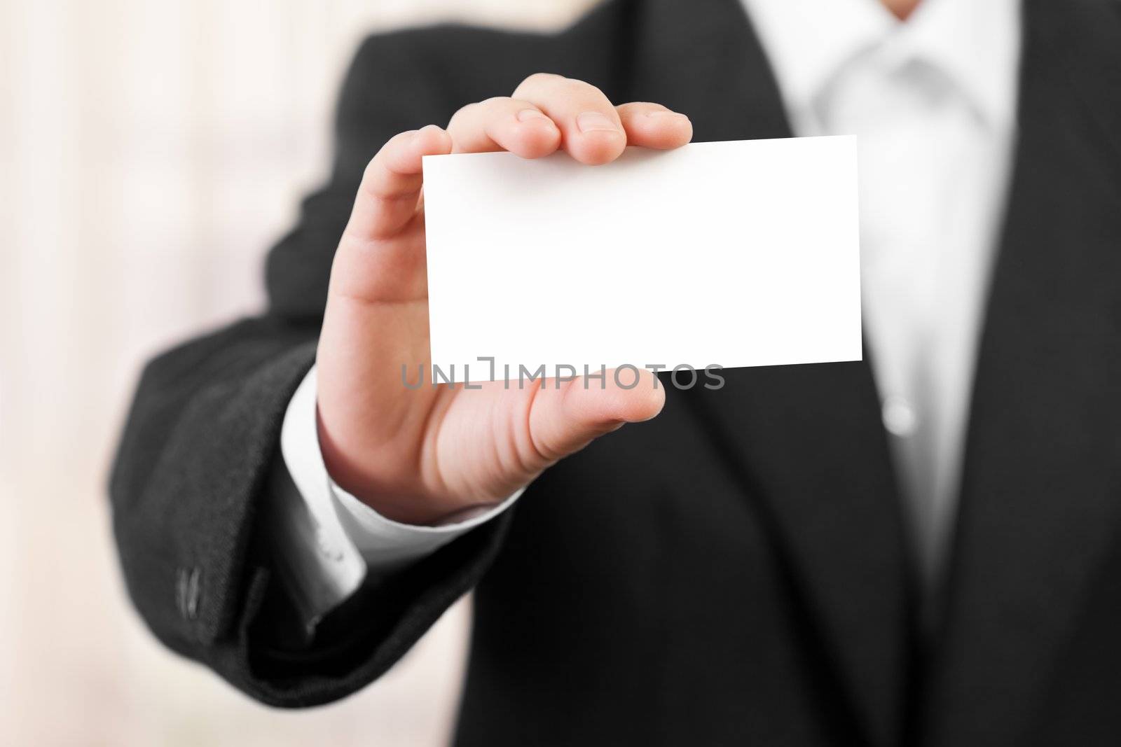 Blank card in businessmen hand by ia_64