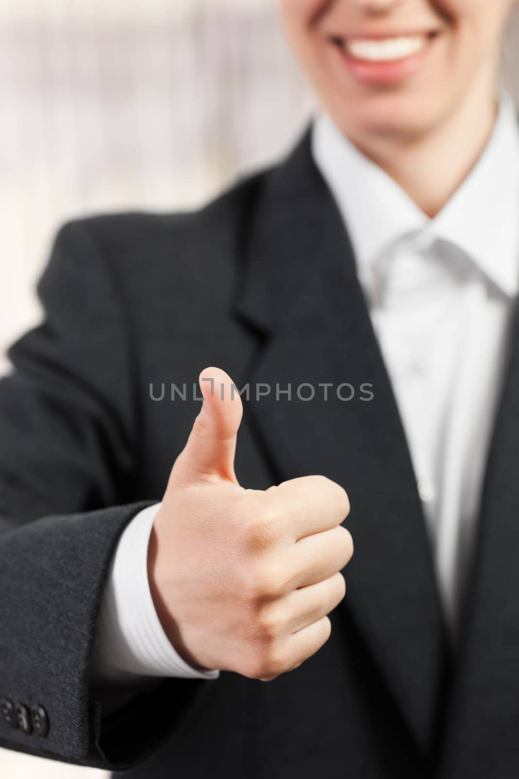 Business women hand gesture thumb up success sign