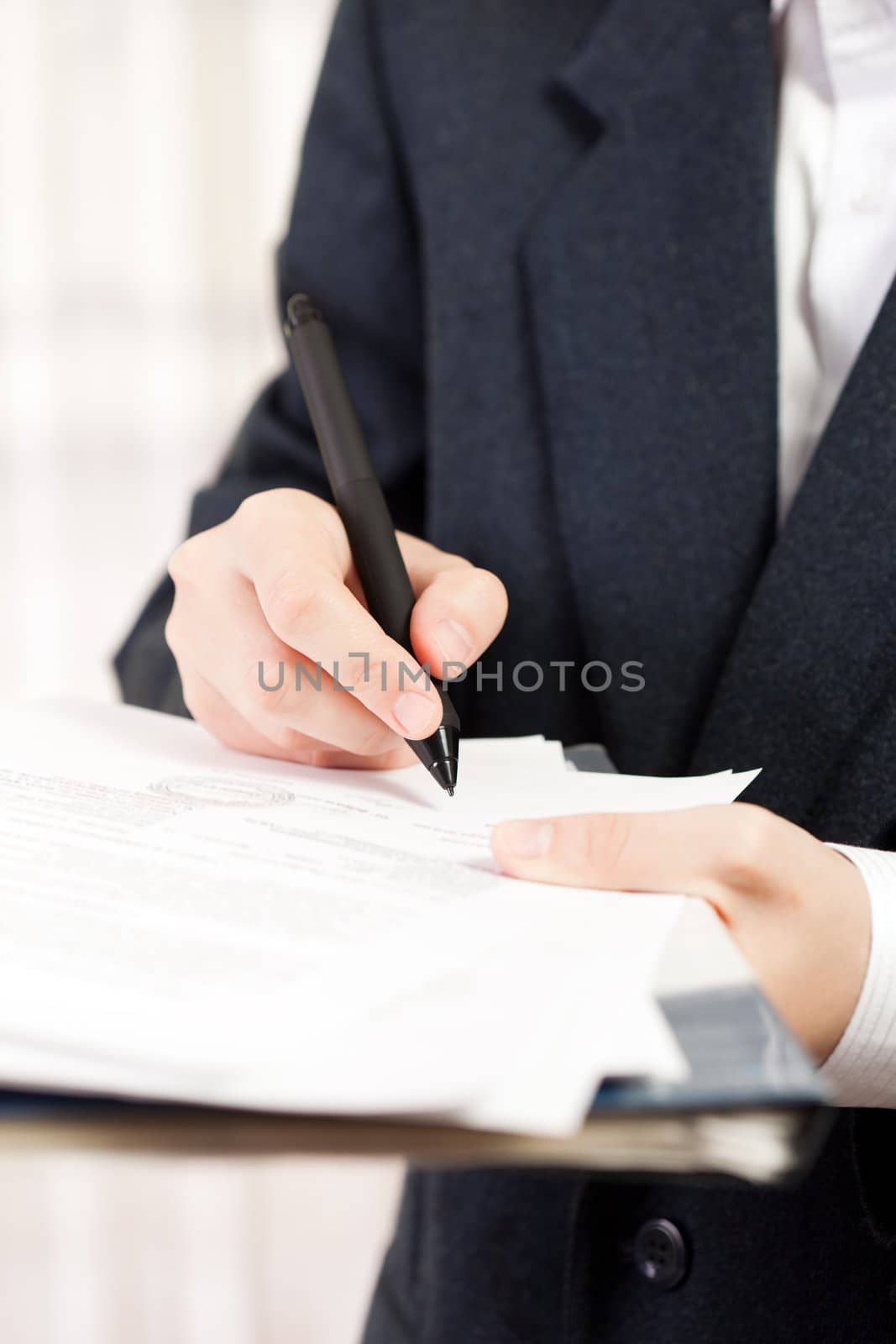 Human business men hand pen writing paper document