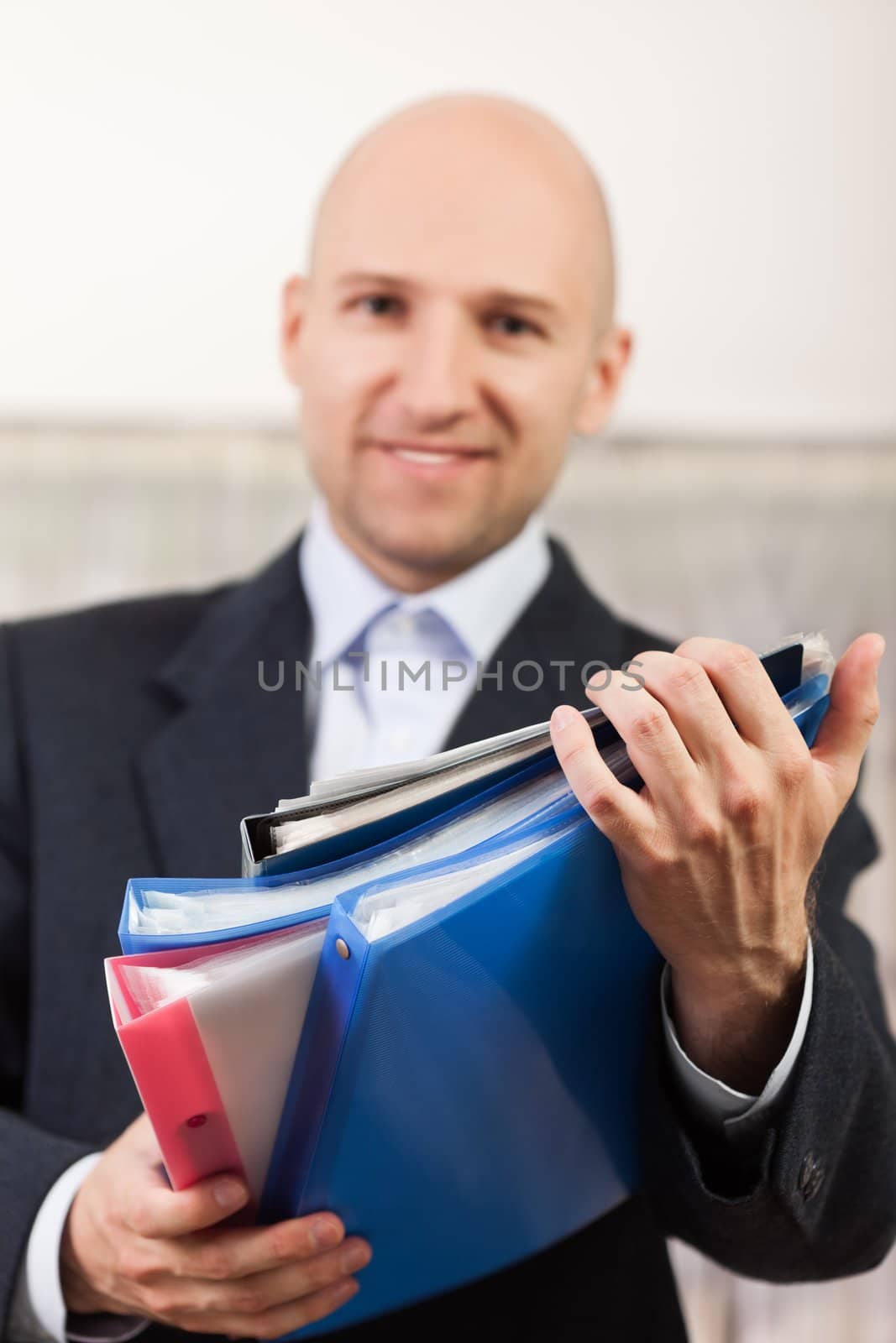 Paperwork - human hand holding business paper file