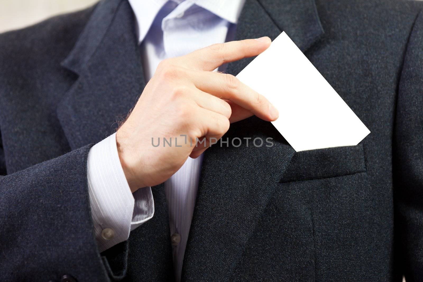 Blank card in businessmen hand by ia_64