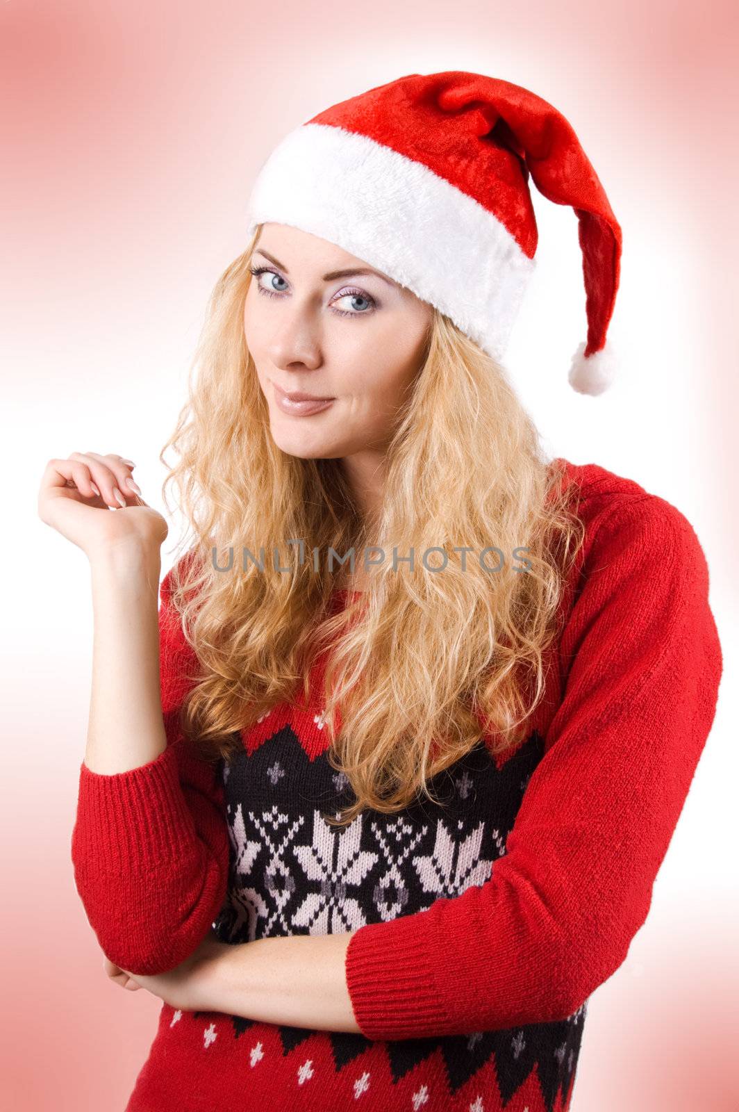 Pretty woman in Santa hat over light red back