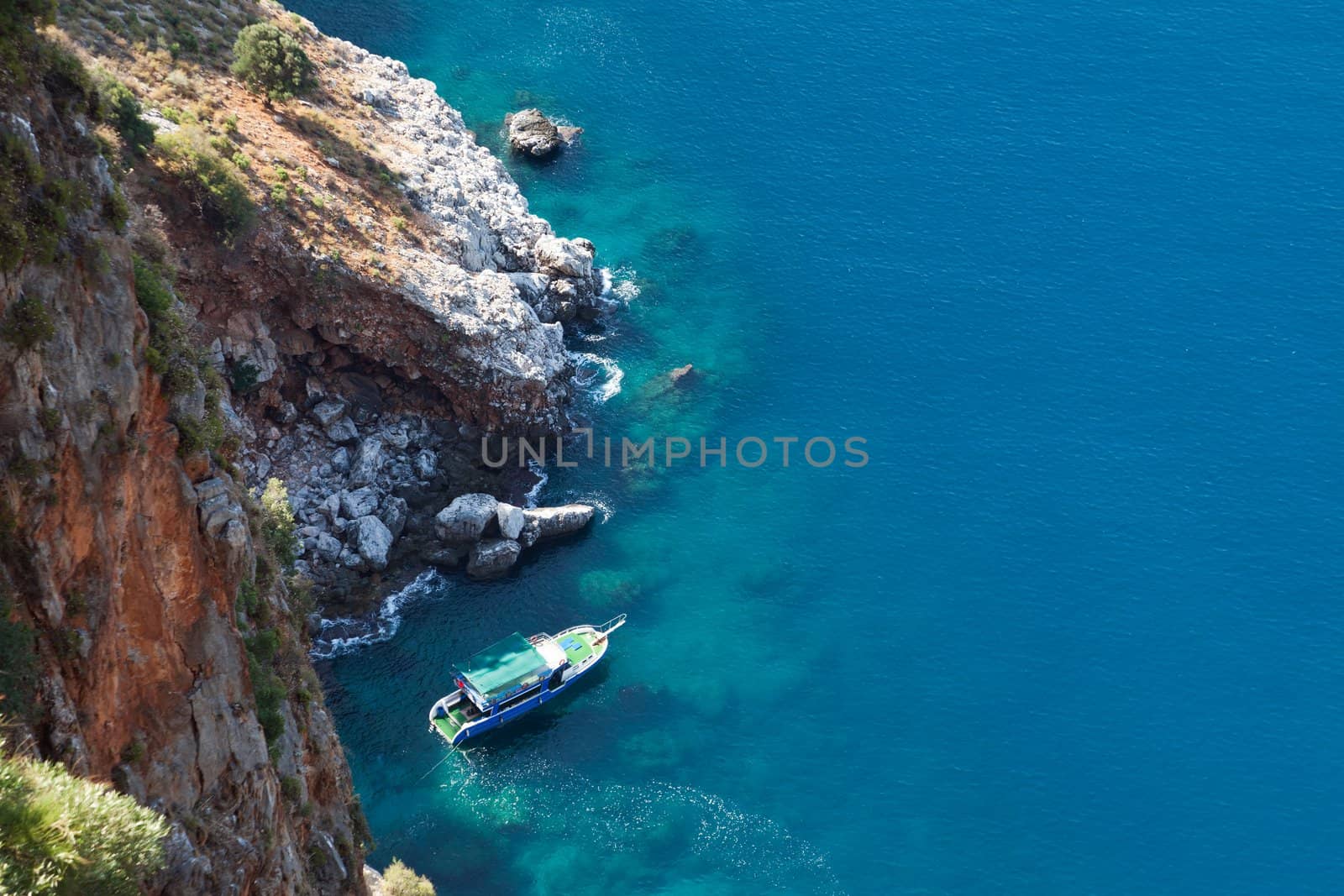 Summer vacations - water diving travel ship or boat at blue sea mountain beach bay