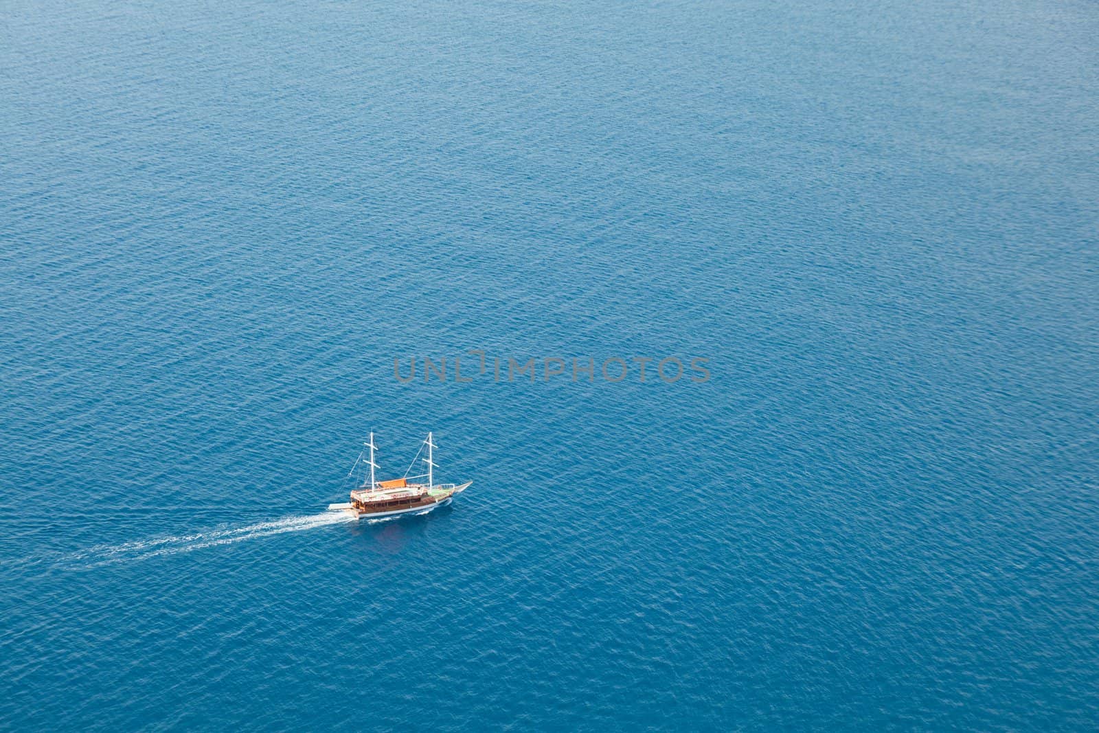 Summer vacations - water travel ship or boat sailing blue sea waves