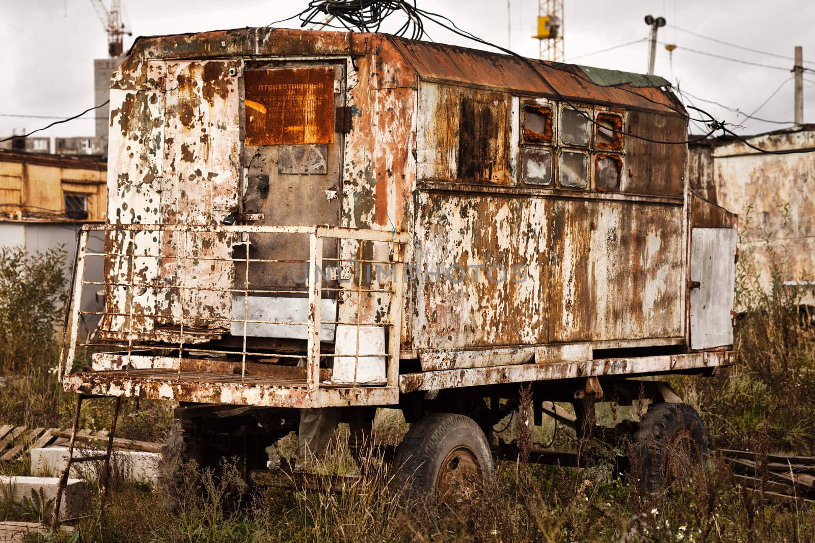 Old rusty wagon on construction site by ia_64