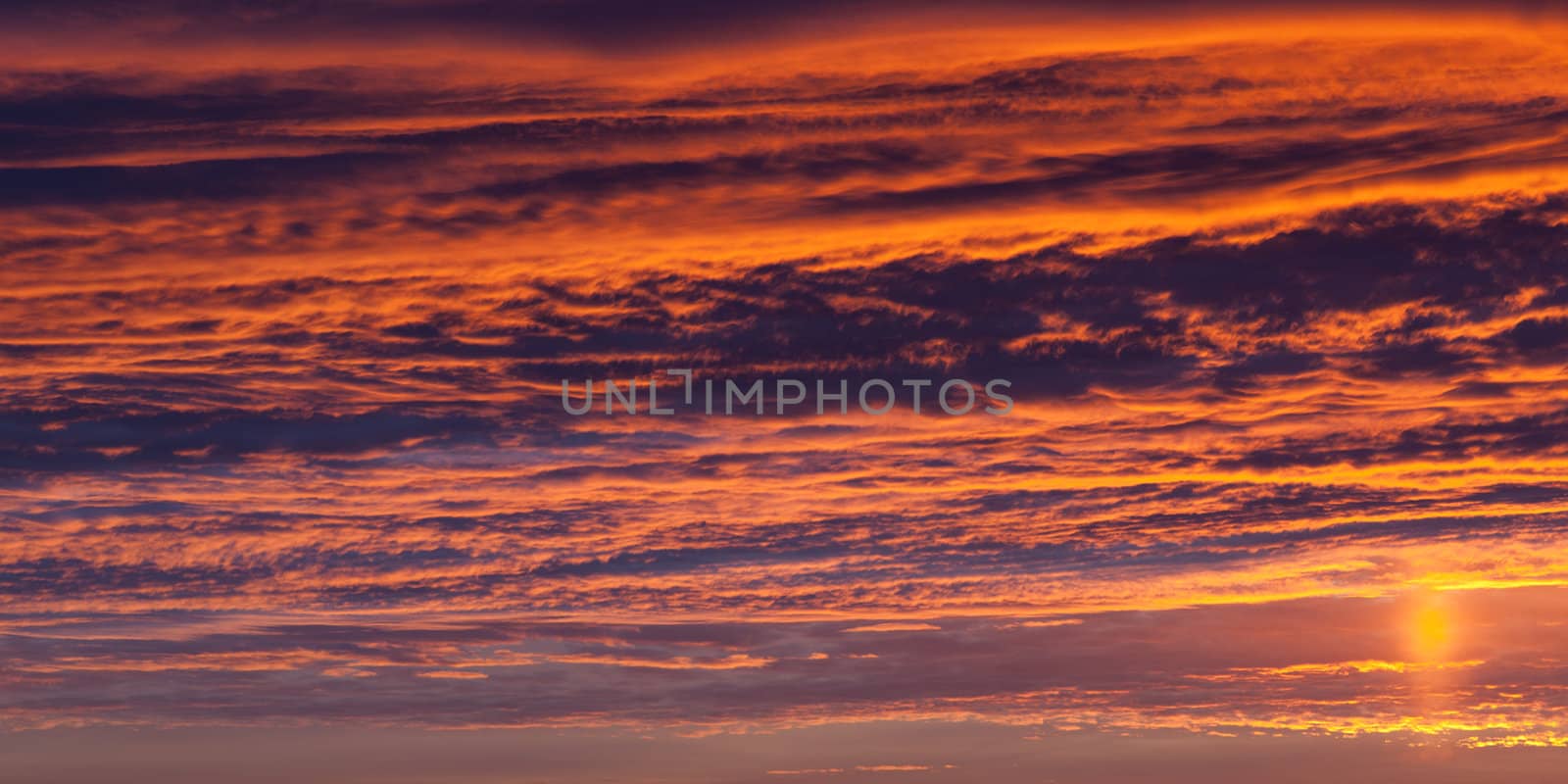 Beautiful nature - dramatic orange sunset on cloud sky