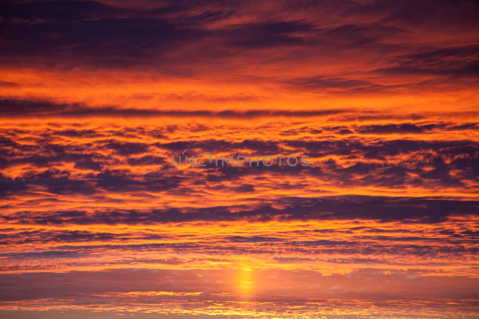 Beautiful nature - dramatic orange sunset on cloud sky