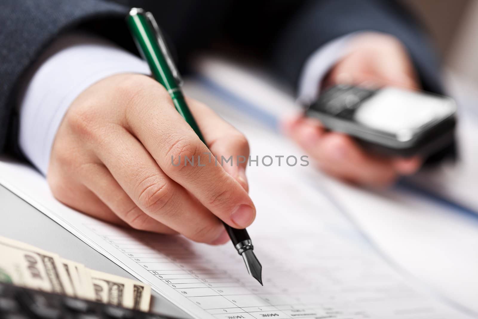 Working business man hand pen writing paper document at office workplace
