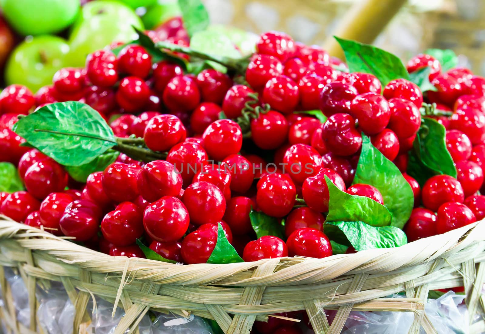 Fake red Cheries on basket in the market