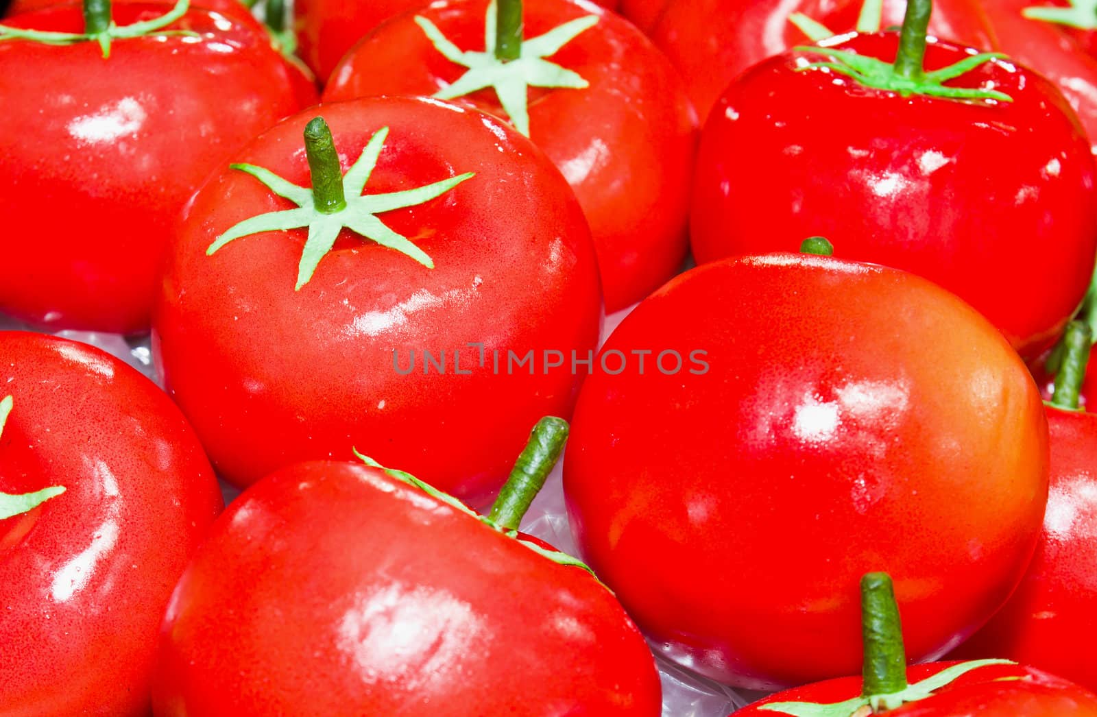 Fake red Tomato on basket in the market